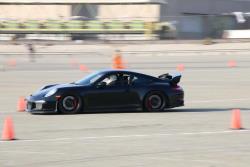 Photo of Scott Fraser on track behind the wheel of the Porsche GT3